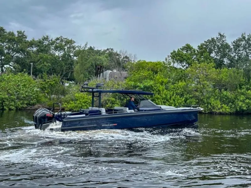 Slide: The Image of 2024 BRABUS Shadow 1000 ST boat cruising on a river. - 3