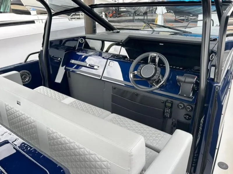 Slide: The Image of 2024 BRABUS Shadow 1000 ST boat interior with luxurious seating and modern dashboard. - 30