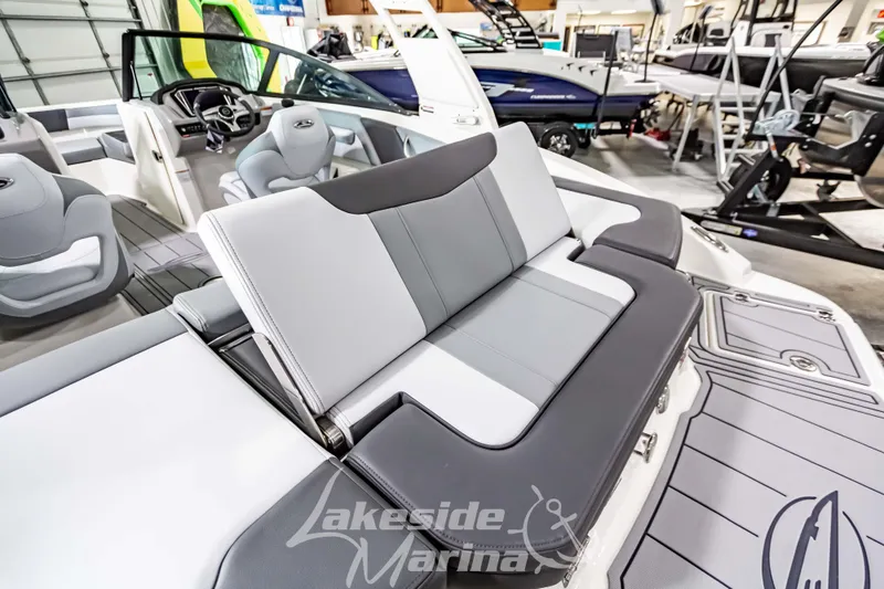 Slide: The Image of 2026 Chaparral 21 SSi boat interior with gray seating at Lakeside Marina. - 13