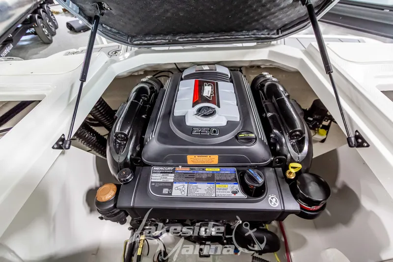 Slide: The Image of 2026 Chaparral 21 SSi boat engine compartment with Mercury 250 horsepower engine. - 18