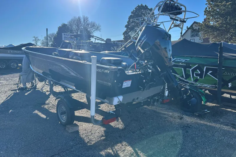 Slide: The Image of 2024 Lund 1600 Fury Tiller boat on trailer, outdoor display. - 3