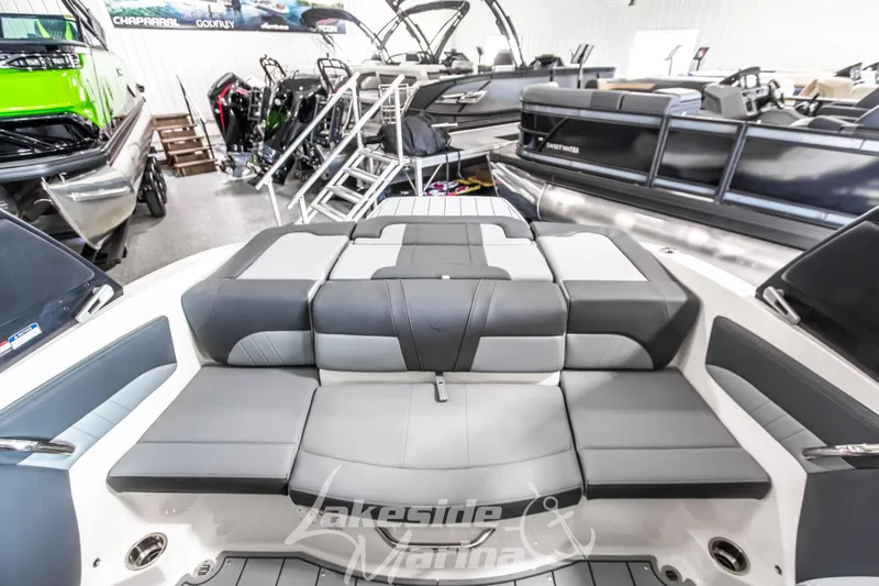 Slide: The Image of 2026 Chaparral 21 SSi boat interior with gray seating at Lakeside Marina showroom. - 13