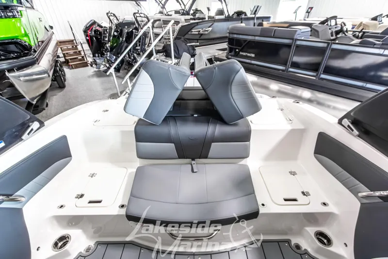 Slide: The Image of 2026 Chaparral 21 SSi boat interior with gray seating at Lakeside Marina showroom. - 16