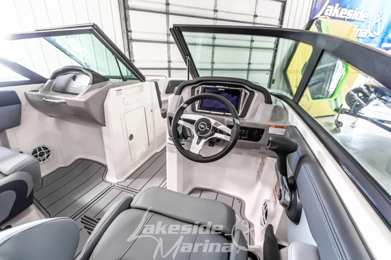 Slide: The Image of 2026 Chaparral 21 SSi boat interior with modern dashboard and steering wheel. - 20
