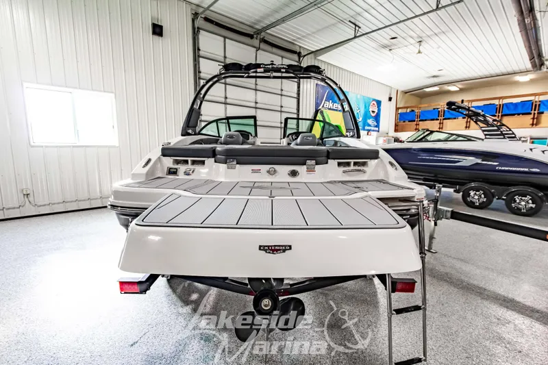 Slide: The Image of 2026 Chaparral 21 SSi boat in showroom, rear view with swim platform. - 4