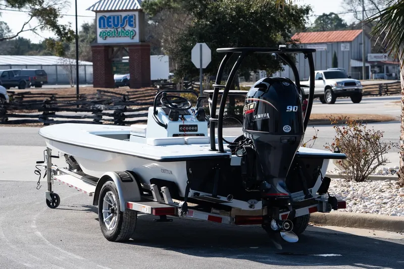 Slide: The Image of 2025 Chittum Skiffs 18 Islamorada boat on trailer, parked near Neuse Sport Shop. - 11