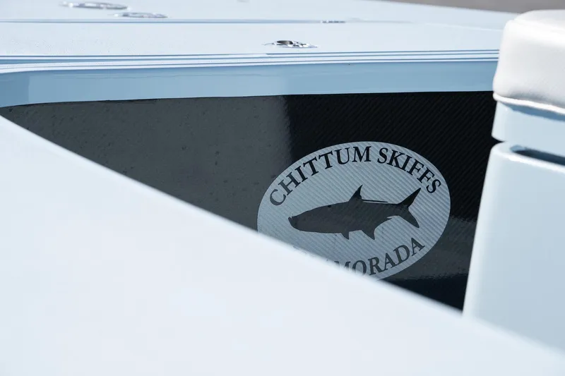 Slide: The Image of 2025 Chittum Skiffs 18 Islamorada boat with logo detail. - 14