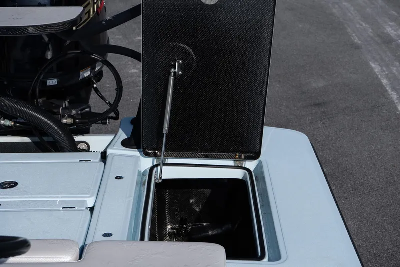 Slide: The Image of Open storage compartment on 2025 Chittum Skiffs 18 Islamorada boat. - 22