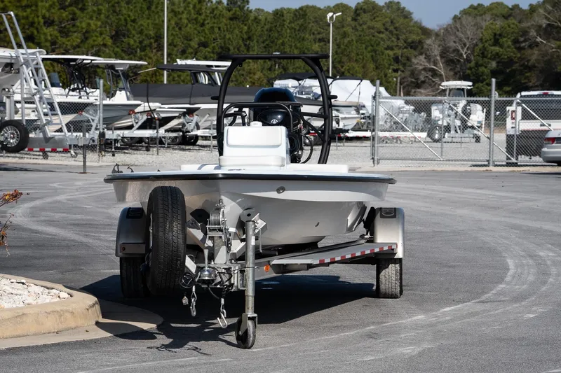 Slide: The Image of 2025 Chittum Skiffs 18 Islamorada boat on trailer in parking lot. - 9