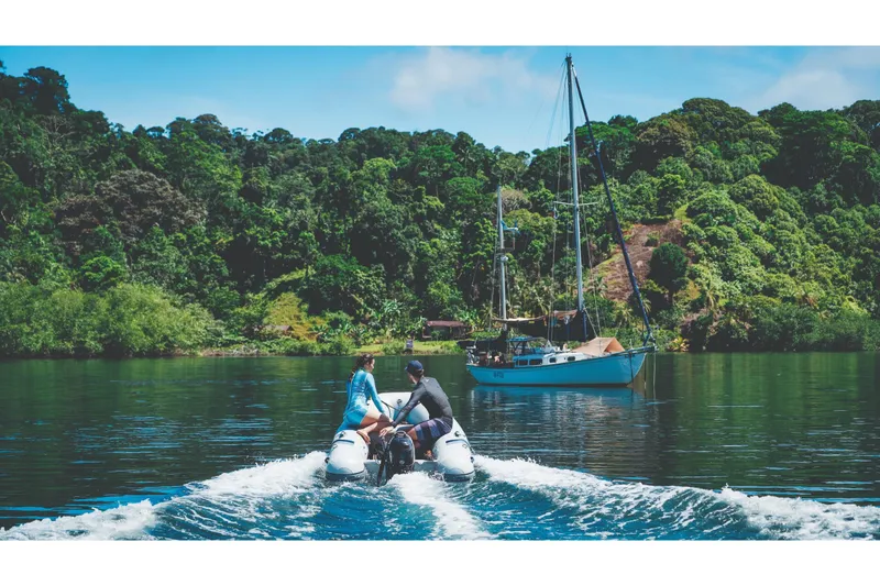 Slide: The Image of Highfield UltraLite 290LT 2024 on a serene lake with lush forest. - 2