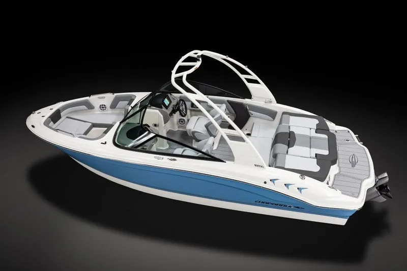 Slide: The Image of 2026 Chaparral 21 SSi boat interior with tan and white seating in showroom. - 12