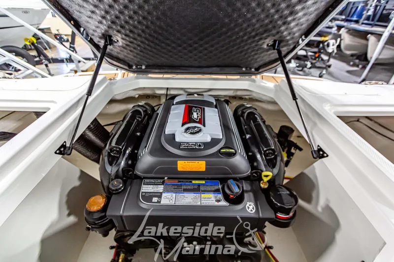 Slide: The Image of 2026 Chaparral 21 SSi boat interior with tan and white seating at Lakeside Marina. - 14