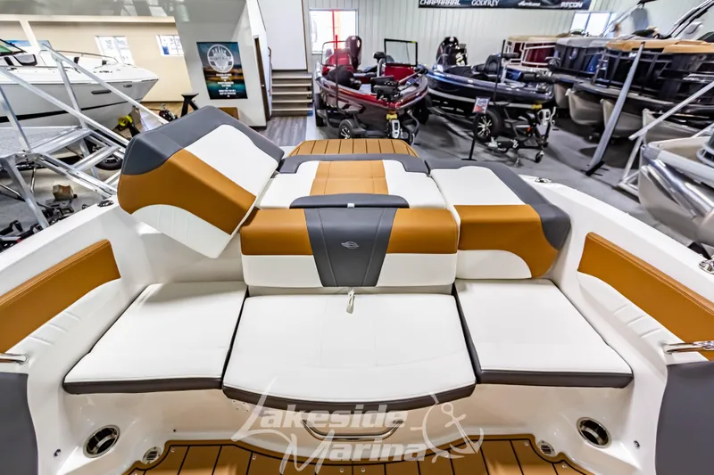 Slide: The Image of 2026 Chaparral 21 SSi boat interior with tan and white seating at Lakeside Marina. - 15