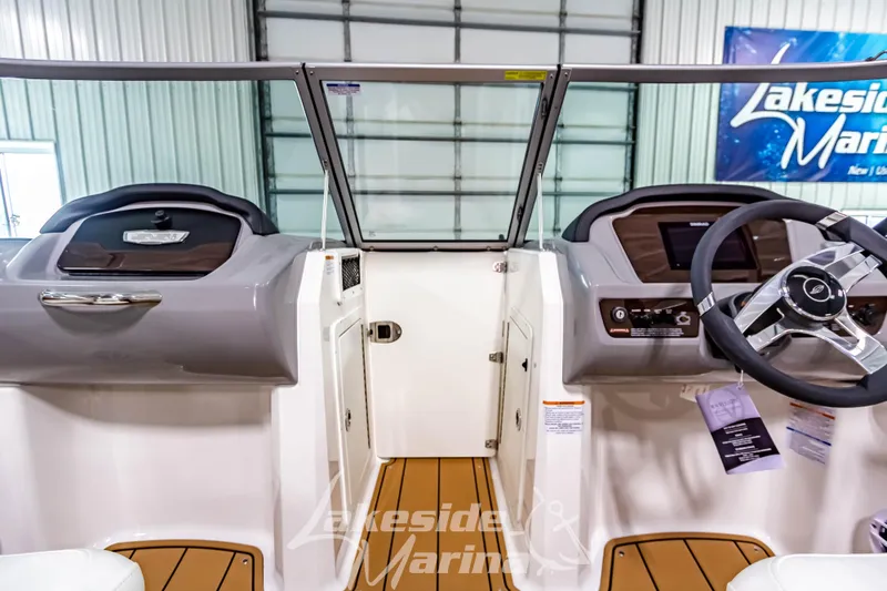 Slide: The Image of 2026 Chaparral 21 SSi dashboard with Simrad display at Lakeside Marina. - 22