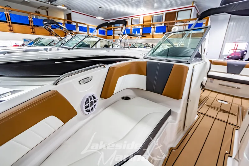 Slide: The Image of Interior view of 2026 Chaparral 21 SSi boat with modern seating and flooring. - 27