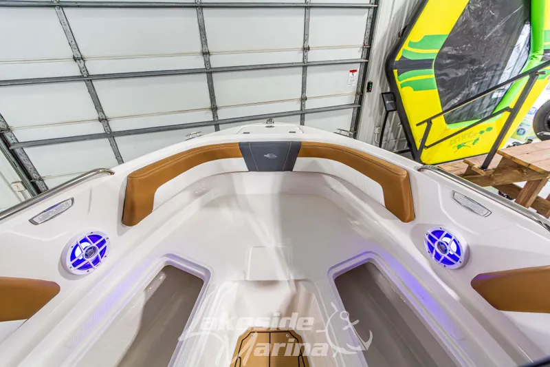 Slide: The Image of 2026 Chaparral 21 SSi boat interior with stylish seating and blue LED lights. - 30