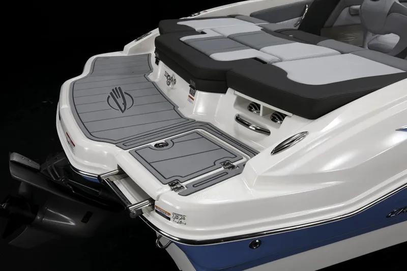 Slide: The Image of 2026 Chaparral 21 SSi boat displayed indoors on a trailer at Lakeside Marina. - 9