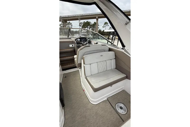 Slide: The Image of Interior view of 2018 Regal 28 Express boat cockpit with steering wheel and controls. - 10
