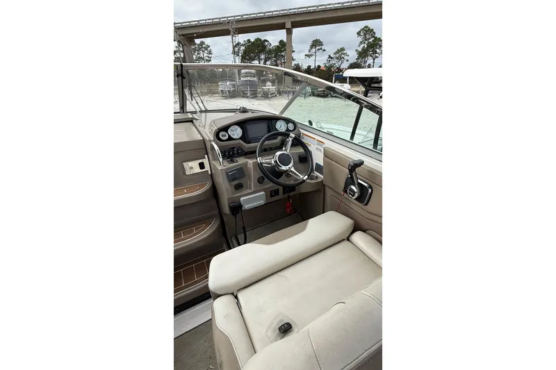 Slide: The Image of Interior view of 2018 Regal 28 Express boat showing steps and seating area. - 11