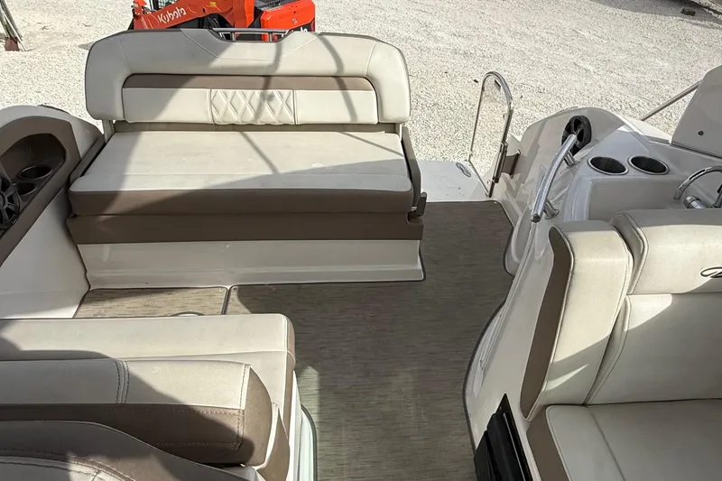 Slide: The Image of 2018 Regal 28 Express boat cockpit with steering wheel and dashboard controls. - 14