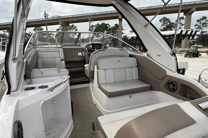 Slide: The Image of 2018 Regal 28 Express boat interior with seating and cup holders. - 8
