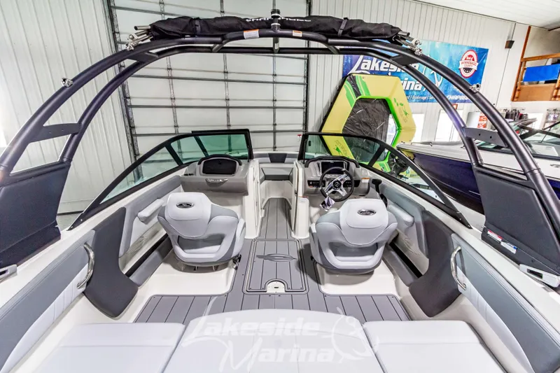 Slide: The Image of 2026 Chaparral 21 SSi boat interior with sleek seating and modern dashboard design. - 10