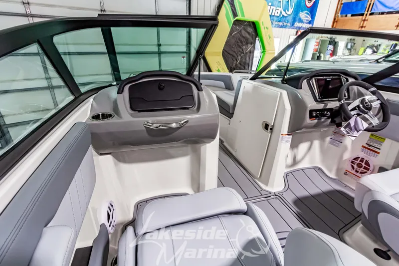Slide: The Image of 2026 Chaparral 21 SSi boat interior with modern dashboard and seating at Lakeside Marina. - 20