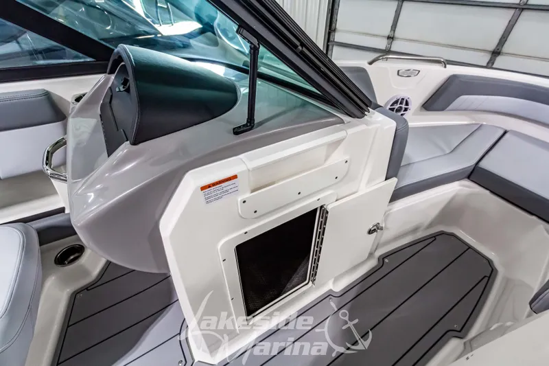 Slide: The Image of 2026 Chaparral 21 SSi boat interior with sleek seating and modern dashboard design. - 24