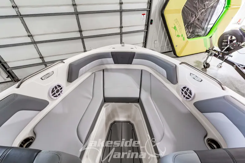 Slide: The Image of Interior view of 2026 Chaparral 21 SSi boat with gray seating and speakers. - 25