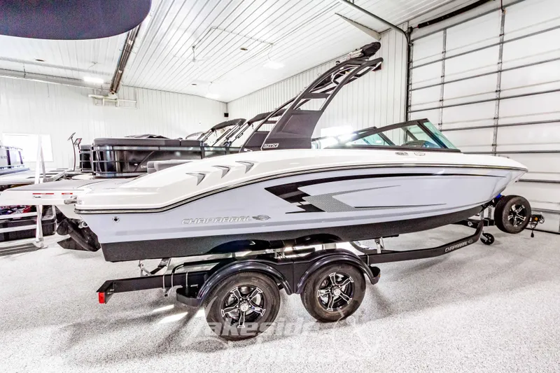 Slide: The Image of 2026 Chaparral 21 SSi boat in showroom, sleek design, on trailer. - 5