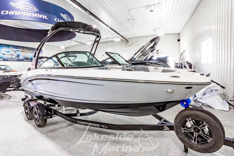 Slide: The Image of 2026 Chaparral 21 SSi boat displayed indoors at Lakeside Marina. - 6
