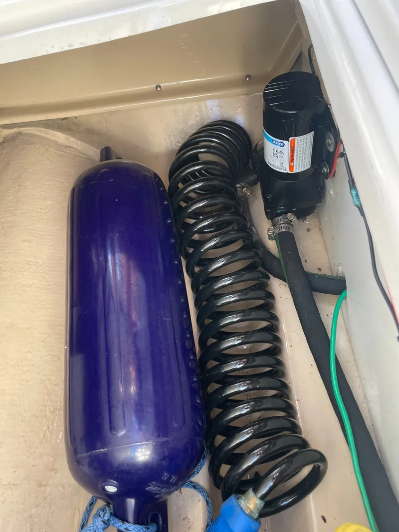 Slide: The Image of 2017 Cutwater C-24 boat components in storage compartment. - 10