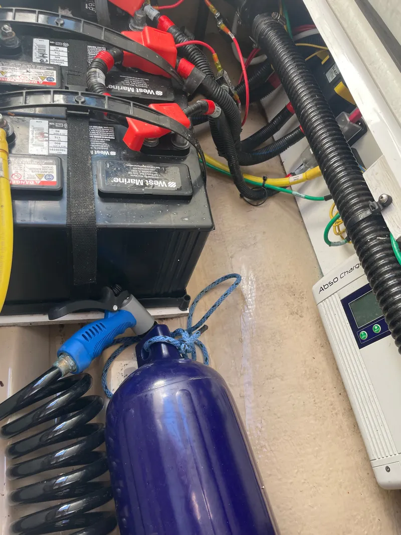 Slide: The Image of Batteries and equipment in the engine compartment of a 2017 Cutwater C-24 boat. - 11