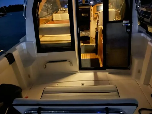 Slide: The Image of Interior of a 2017 Cutwater C-24 boat at night. - 13