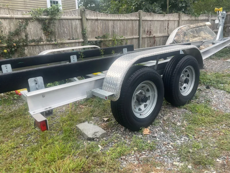 Slide: The Image of Boat trailer for 2017 Cutwater C-24 on gravel path. - 15