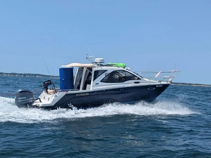 Slide: The Image of 2017 Cutwater C-24 boat cruising on the water. - 2