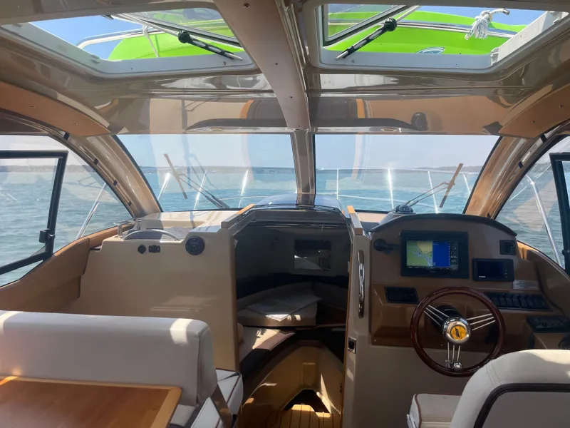 Slide: The Image of Interior view of a 2017 Cutwater C-24 boat on the water. - 5