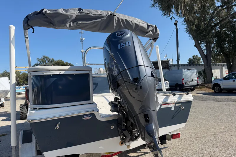 Slide: The Image of 2026 Hurricane FunDeck 198 RE OB boat with cushioned seating and outboard motor. - 4