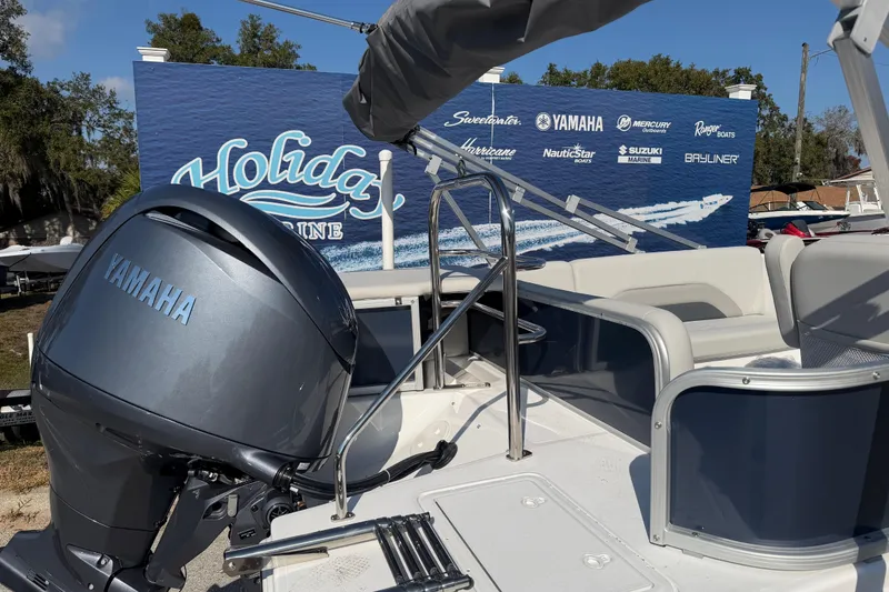 Slide: The Image of 2026 Hurricane FunDeck 198 RE OB boat interior with steering wheel and gauges. - 5