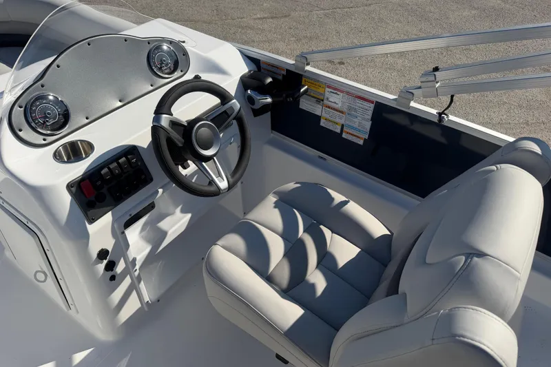Slide: The Image of 2026 Hurricane FunDeck 198 RE OB boat interior with seating and steering console. - 7