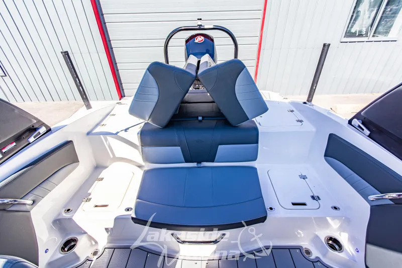 Slide: The Image of 2026 Chaparral 21 SSi OB boat interior with blue and white seating. - 17