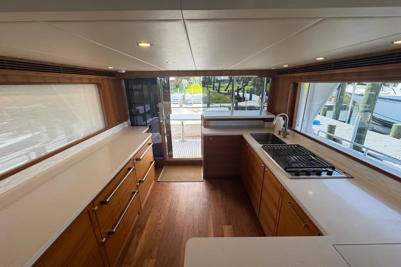 Slide: The Image of Luxurious kitchen interior of 2023 Outer Reef Yachts 670 Azure Motoryacht, featuring modern appliances. - 13