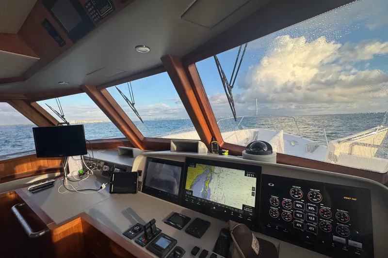 Slide: The Image of Cockpit view of 2023 Outer Reef Yachts 670 Azure Custom Motoryacht at sea. - 17