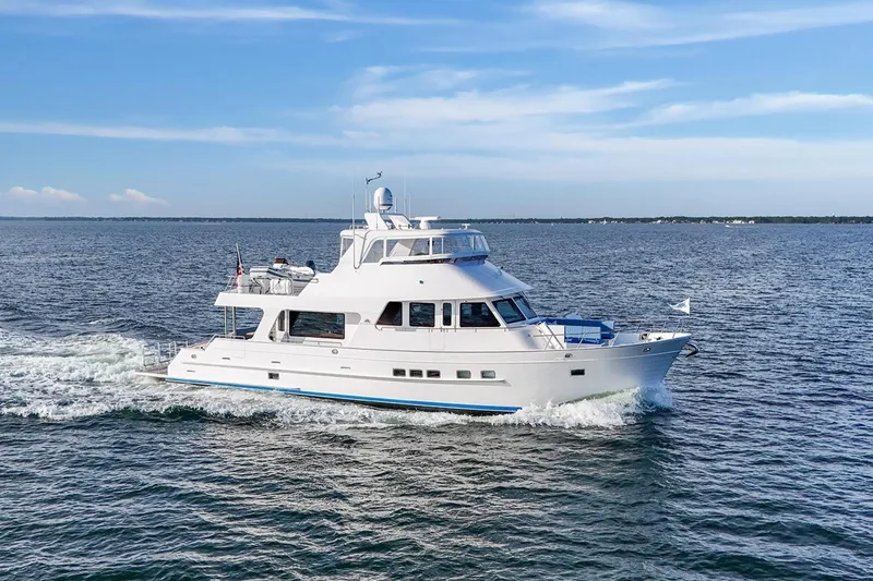 Slide: The Image of 2023 Outer Reef Yachts 670 Azure Custom Cockpit Motoryacht cruising on open water. - 3