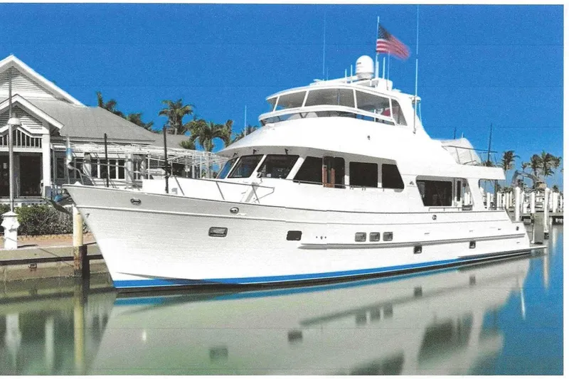 Slide: The Image of 2023 Outer Reef Yachts 670 Azure Custom Cockpit Motoryacht docked in a marina. - 1