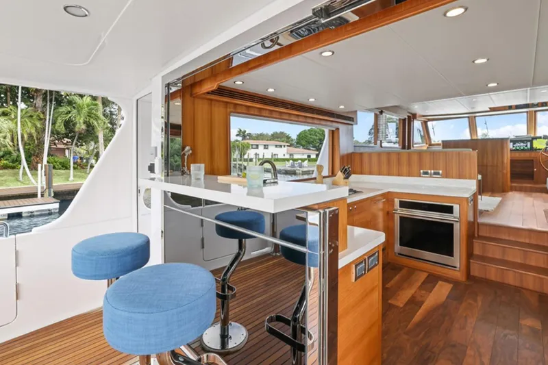 Slide: The Image of Luxurious interior of 2023 Outer Reef Yachts 670 Azure Custom Cockpit Motoryacht with modern kitchen. - 10