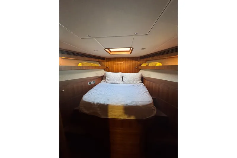 Slide: The Image of Luxurious cabin interior of 2023 Outer Reef Yachts 670 Azure Motoryacht, featuring cozy bedding. - 19