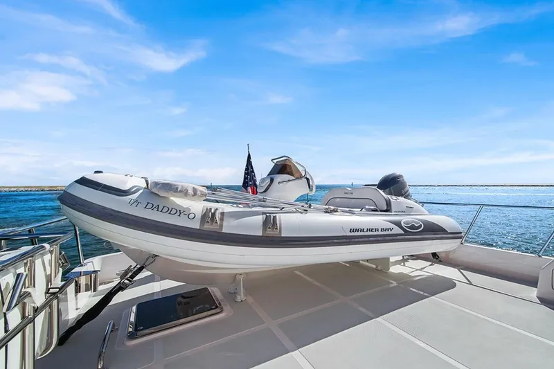 Slide: The Image of 2023 Outer Reef Yachts 670 Azure with Walker Bay tender on deck, ocean backdrop. - 25