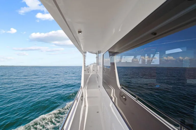 Slide: The Image of 2023 Outer Reef Yachts 670 Azure Custom Cockpit Motoryacht cruising on open sea. - 7