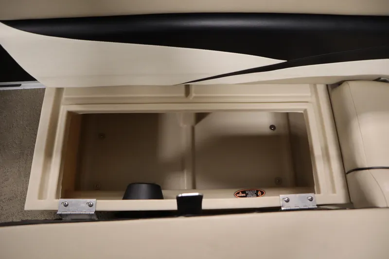 Slide: The Image of 2013 Harris Cruiser 220 storage compartment, beige interior, open lid view. - 13